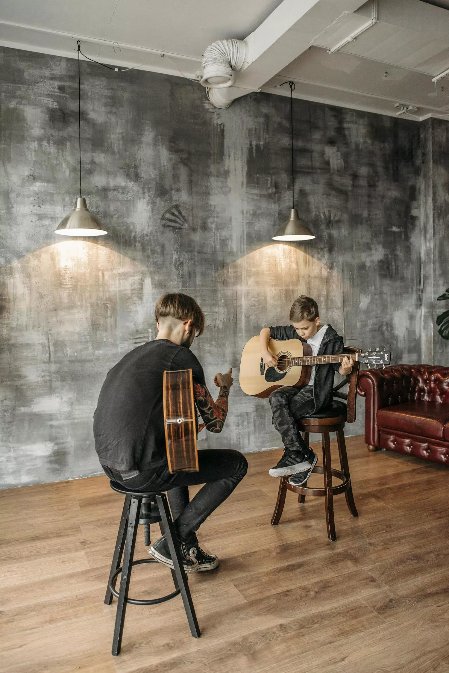 Guitar teacher and student